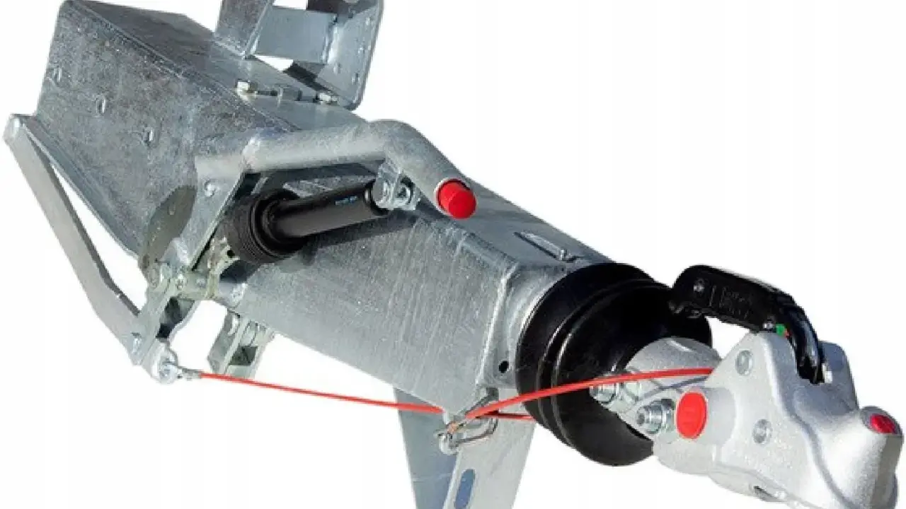 Metalowy hamulec najazdowy do przyczepy, z mechanizmem i zaczepem kulowym.