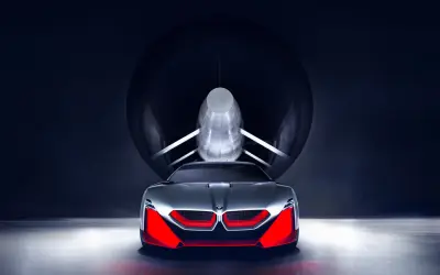 Przyszłościowy koncept BMW M9 w tunelu aerodynamicznym, z agresywnym przodem i czerwonymi akcentami.