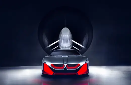 Przyszłościowy koncept BMW M9 w tunelu aerodynamicznym, z agresywnym przodem i czerwonymi akcentami.