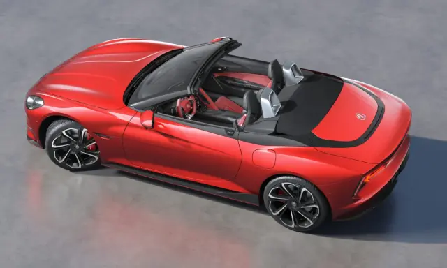 Czerwony mg roadster z czarnym dachem i sportowymi felgami, gotowy na przejażdżkę.
