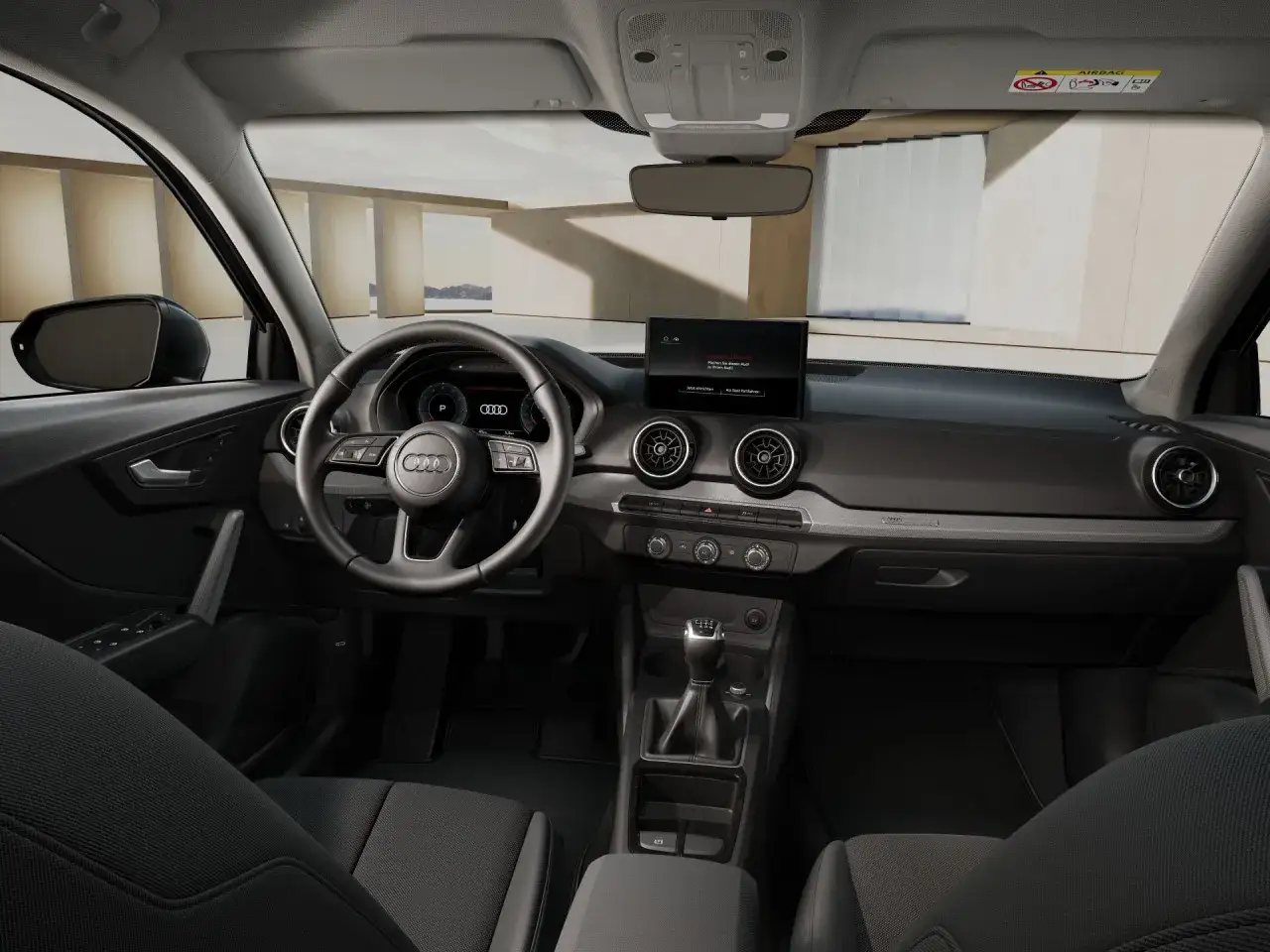 Wnętrze Audi Q2, z kierownicą, ekranem multimedialnym i dźwignią zmiany biegów. Sprawdź atrakcyjną audi q2 cena.